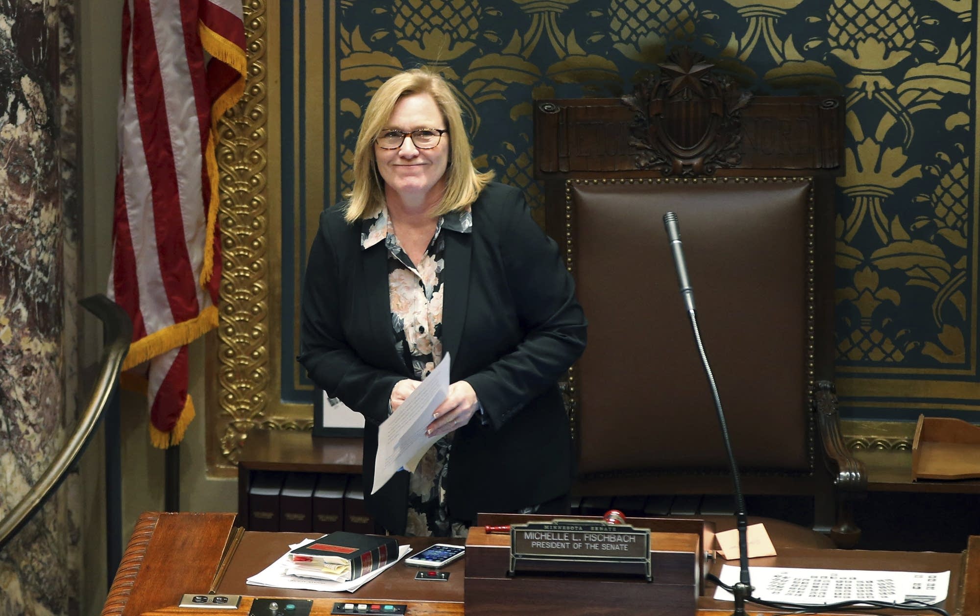 Senate President Michelle Fischbach smiles at photographers in the gallery.
