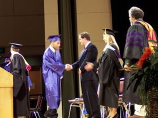 The graduation handshake