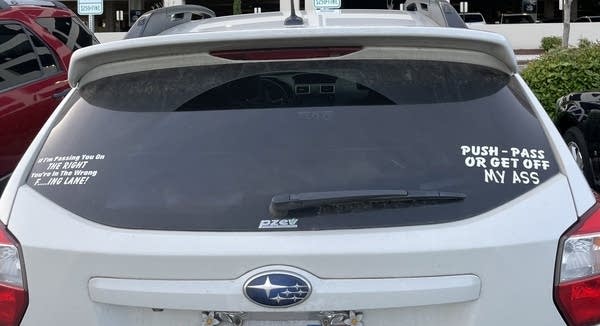 bumper sticker on car: "if I'm passing you on left, you're in wrong lane"