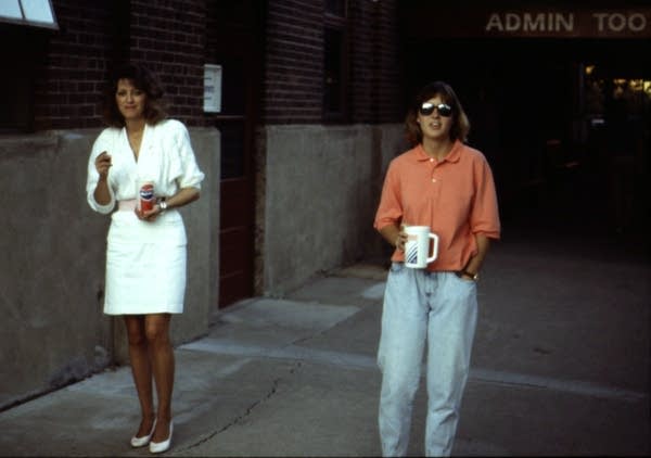 Two women stand for a photo