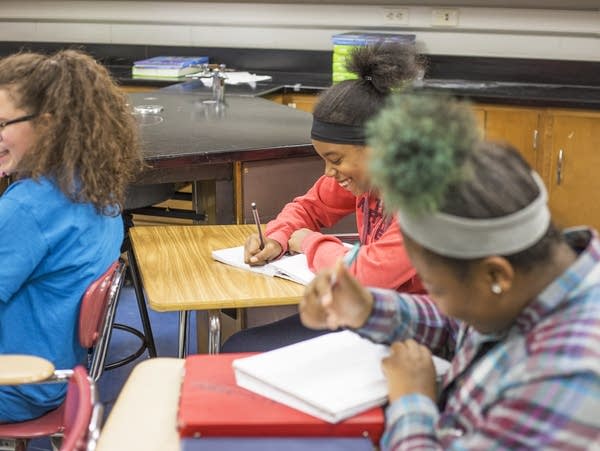 A student works on an assignment in her life science class.