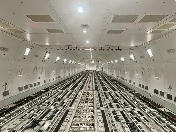 Tracks on the interior of a cargo plane.
