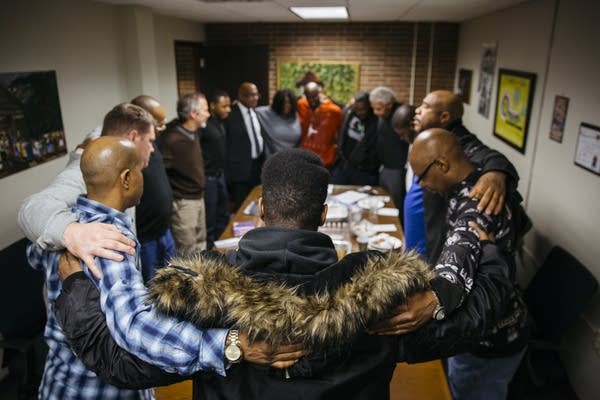 Power of People members gather at the end of a weekly group meeting