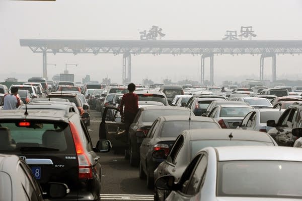 Chinese motorists get out of their cars