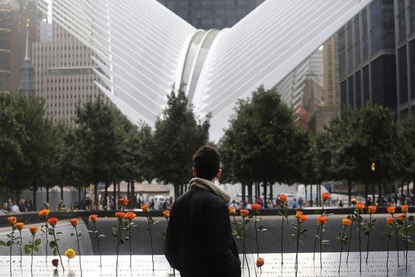 A man looks at the North Pool at the World Trade Center.