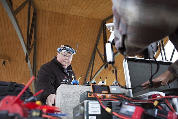 Pilot Tony Bjerke of Fargo prepares his drone and related gear for a race.