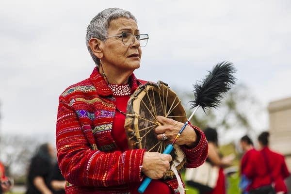 A person holds a drum