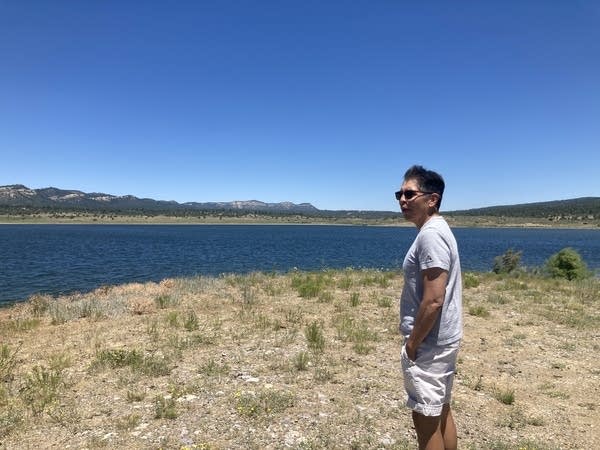 Daryl Vigil, a retired water administrator, looks at a reservoir on Jicarilla Apache Nation land.