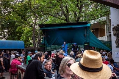 Band performing on stage and crowd 