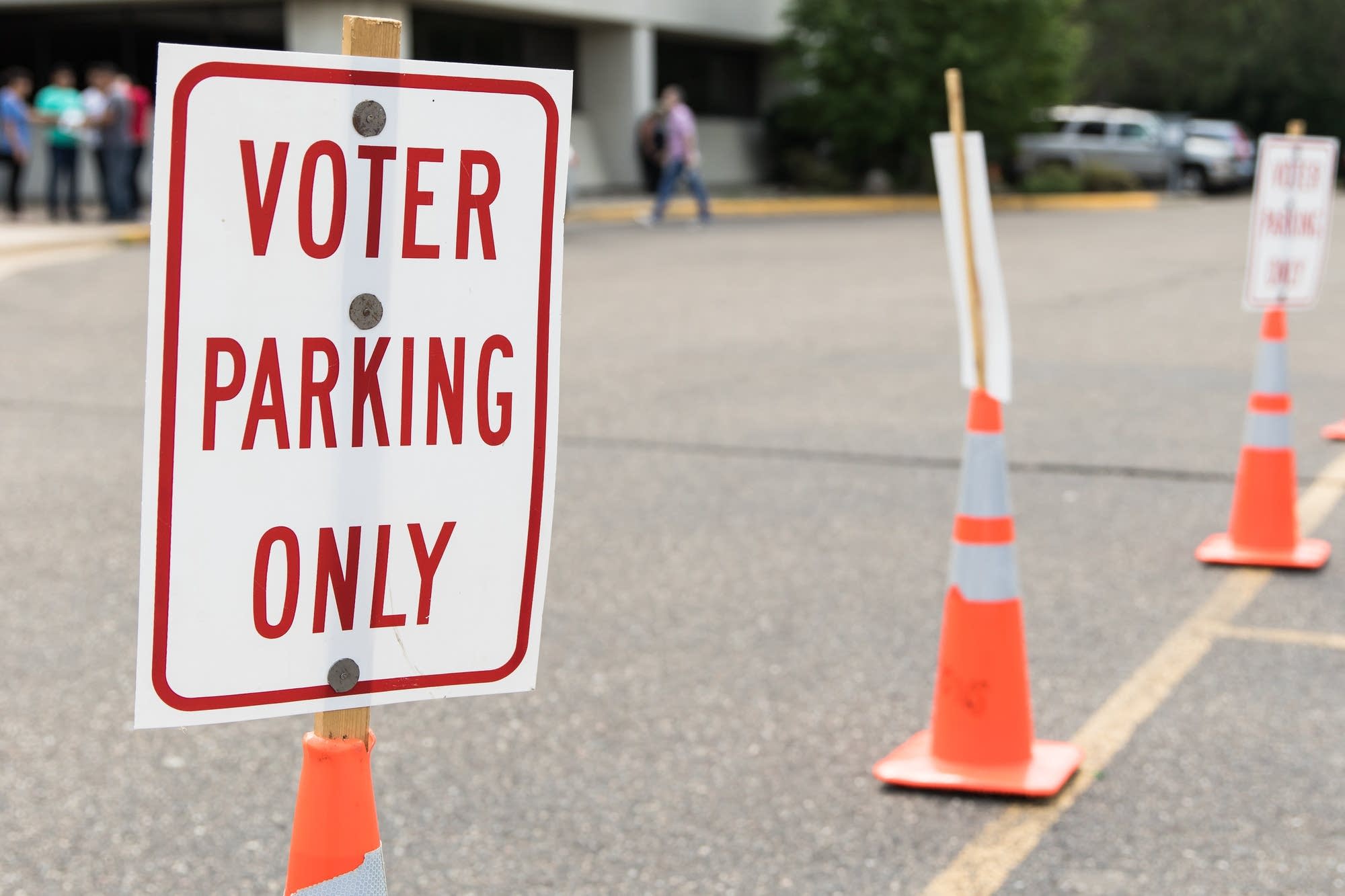 Signs mark parking spots that are reserved for voters.