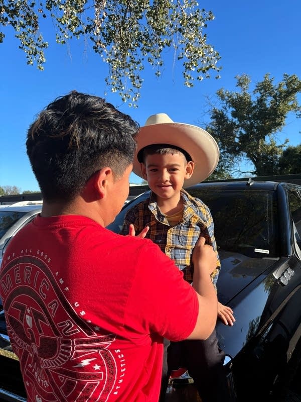 child in cowboy hat