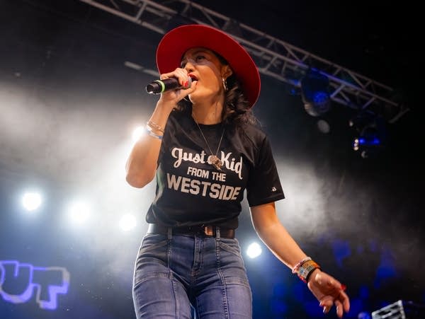 Maria Isa raps into a microphone.