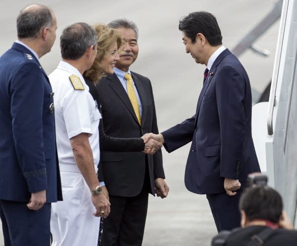 Caroline Kennedy greets Shinzo Abe