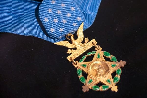 A medal is on display.