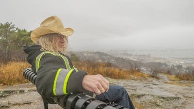 Alan Sparhawk poses for a photo wearing a cowboy hat near Enger Tower in Duluth.