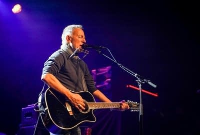 Bruce Springsteen performing on stage