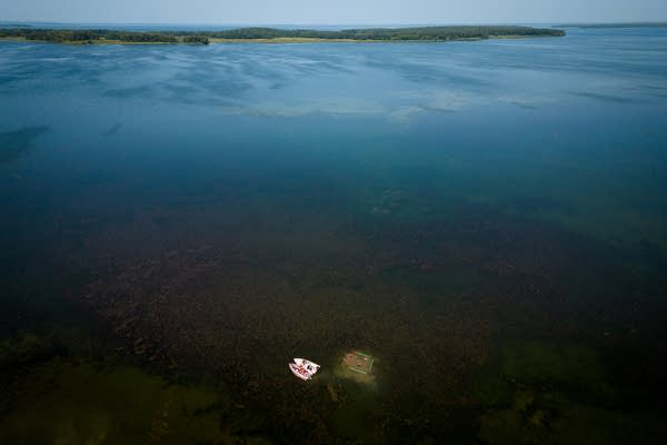 An aerial view of divers working on a lake