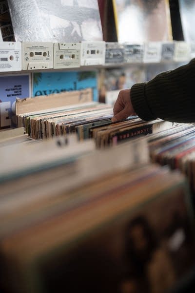 A person browses records in a record store