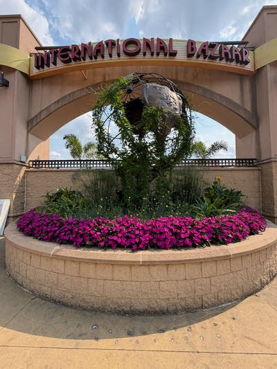 The International Bazaar sign with flowers