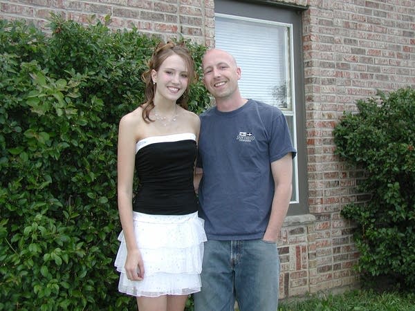 Father and daughter pose for portrait