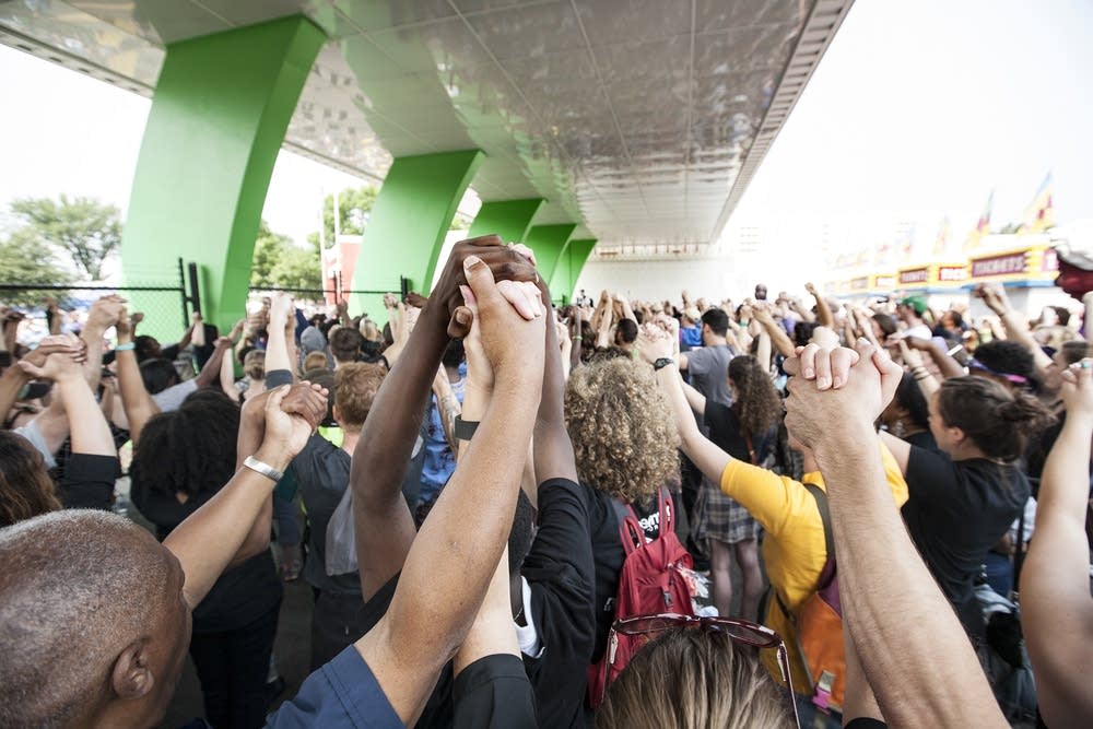 Protestors held hands in solidarity before leaving