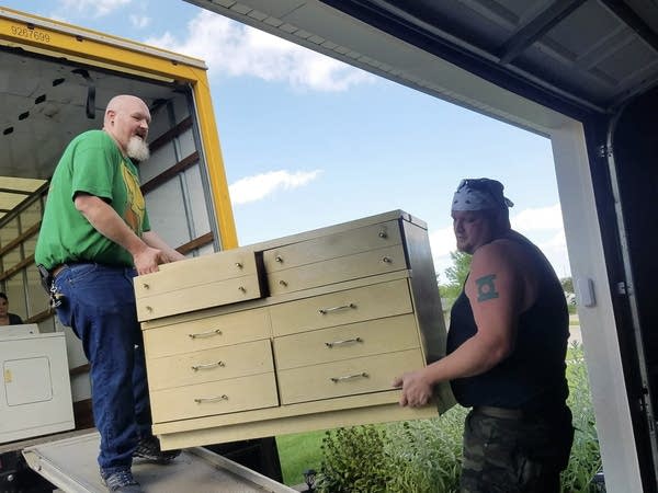 Lincoln Fegley and his brother Joshua Fegley move furniture into Lincoln's new home in Troy, Mo. (Courtesy of the Fegley family)