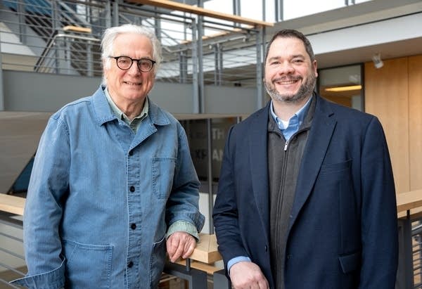 two men posing for a portrait