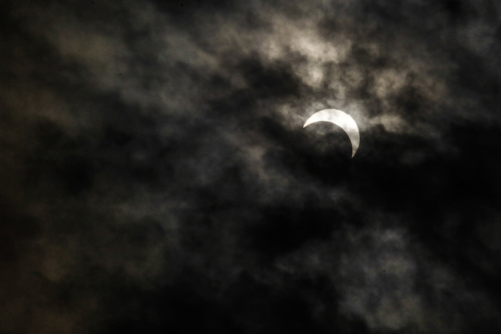 The last bit of the eclipse was in view in St. Paul, Minn.