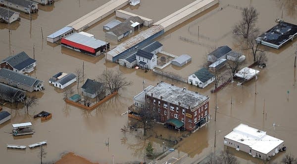 Residents and business are seen submerged in flood water from the Meremac River on December 31, 2015 in downtown Pacific, Missouri. The St. Louis area and surrounding region are experiencing record flood crests of the Mississippi, Missouri and Meremac Rivers after days of record rainfall.