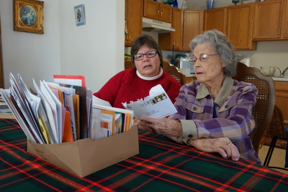 Yvonne and Jody looking at mail