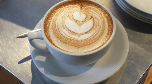 A cup of just-brewed flat white — a variation on the classic cappuccino. 