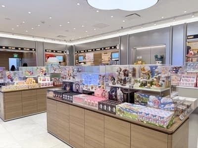 Colorful figurines and dolls displayed in a sleek store