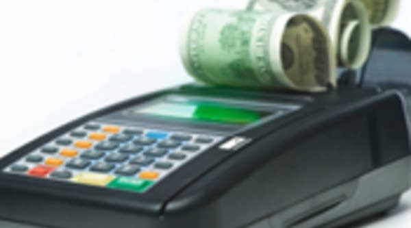 $100 bills and a credit card machine.