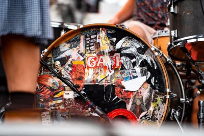 Gash performing on an outdoor stage.