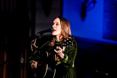 A musician performing onstage in a church
