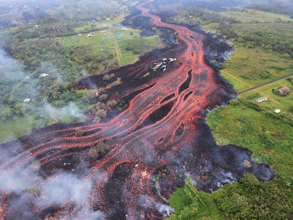 Faster-moving Hawaii lava gushes into sea, spews new danger