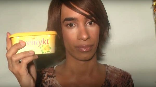Screenshot of upset YouTuber TommyLife holding empty butter container