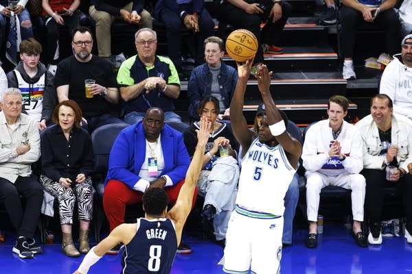 two basketball players in action