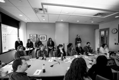 The Current staff meet in the Capitol View conference room.