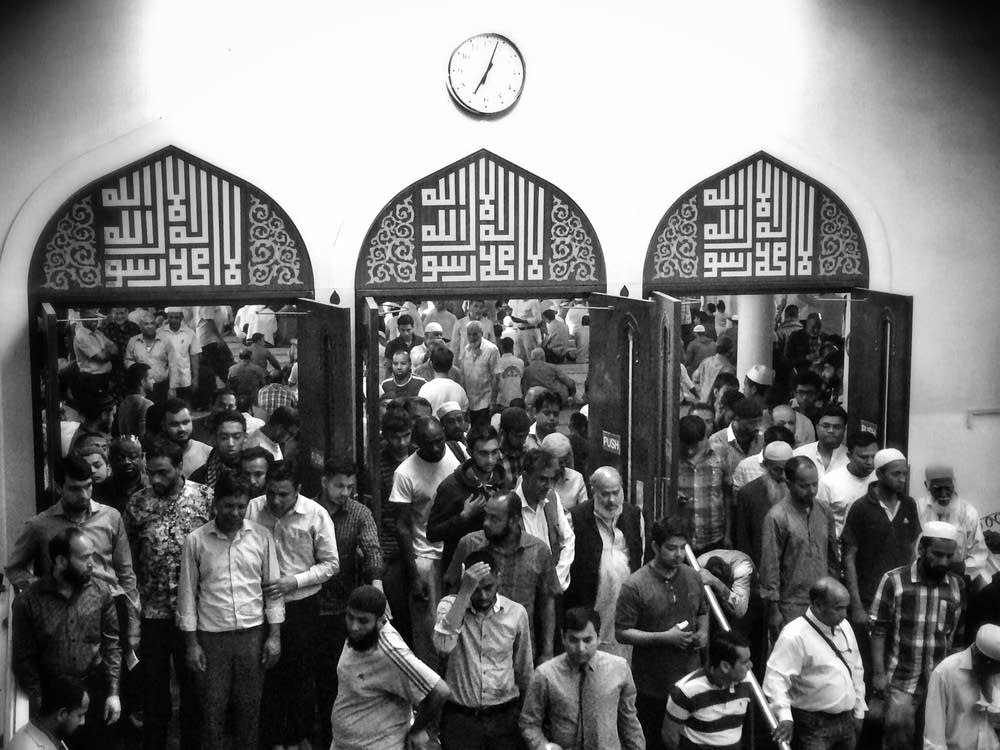 Muslim men leave after prayer