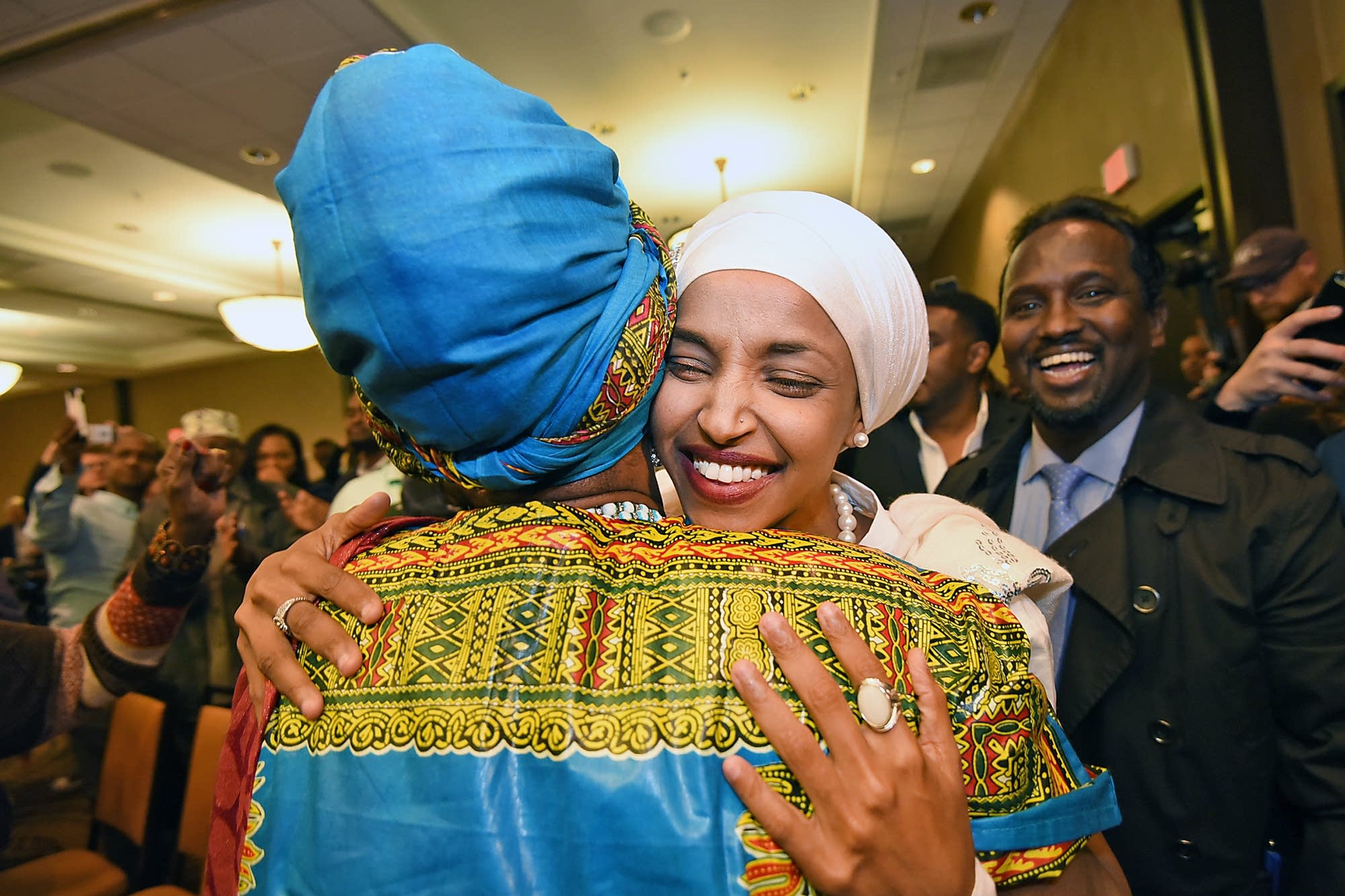 Supporters congratulate Omar.