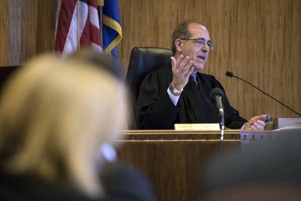 Chief Judge John H. Guthmann speaks during a motion hearing.