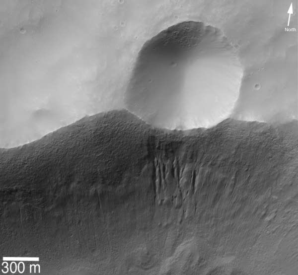 Gullies beneath a small crater on Mars