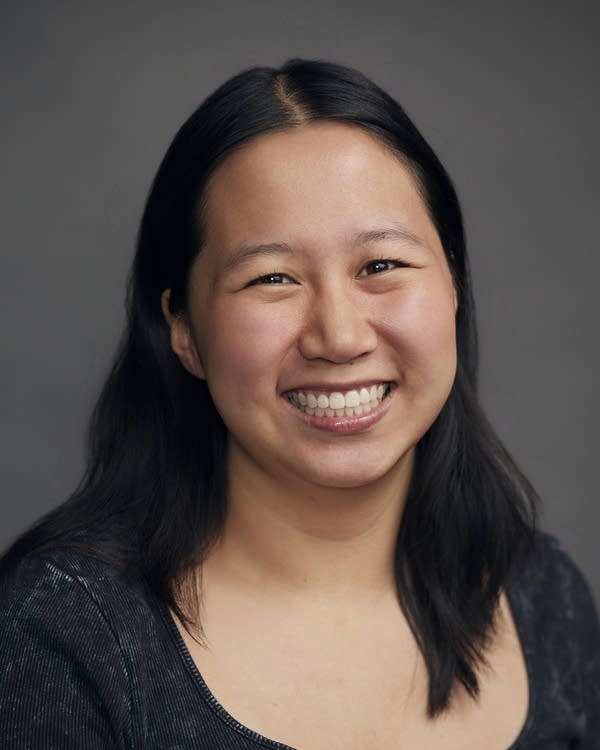 A woman smiles for a photo