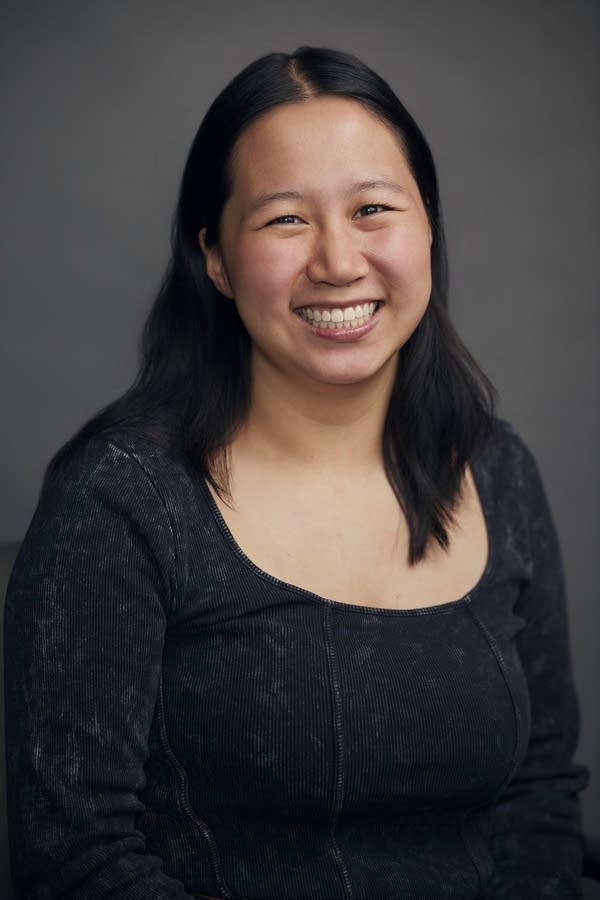 A woman smiles for a photo