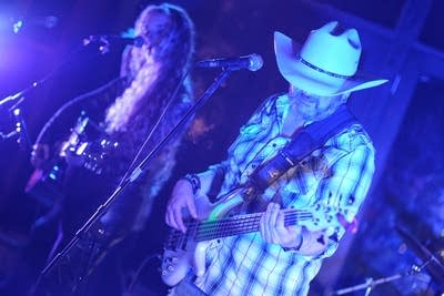 Two musicians performing onstage