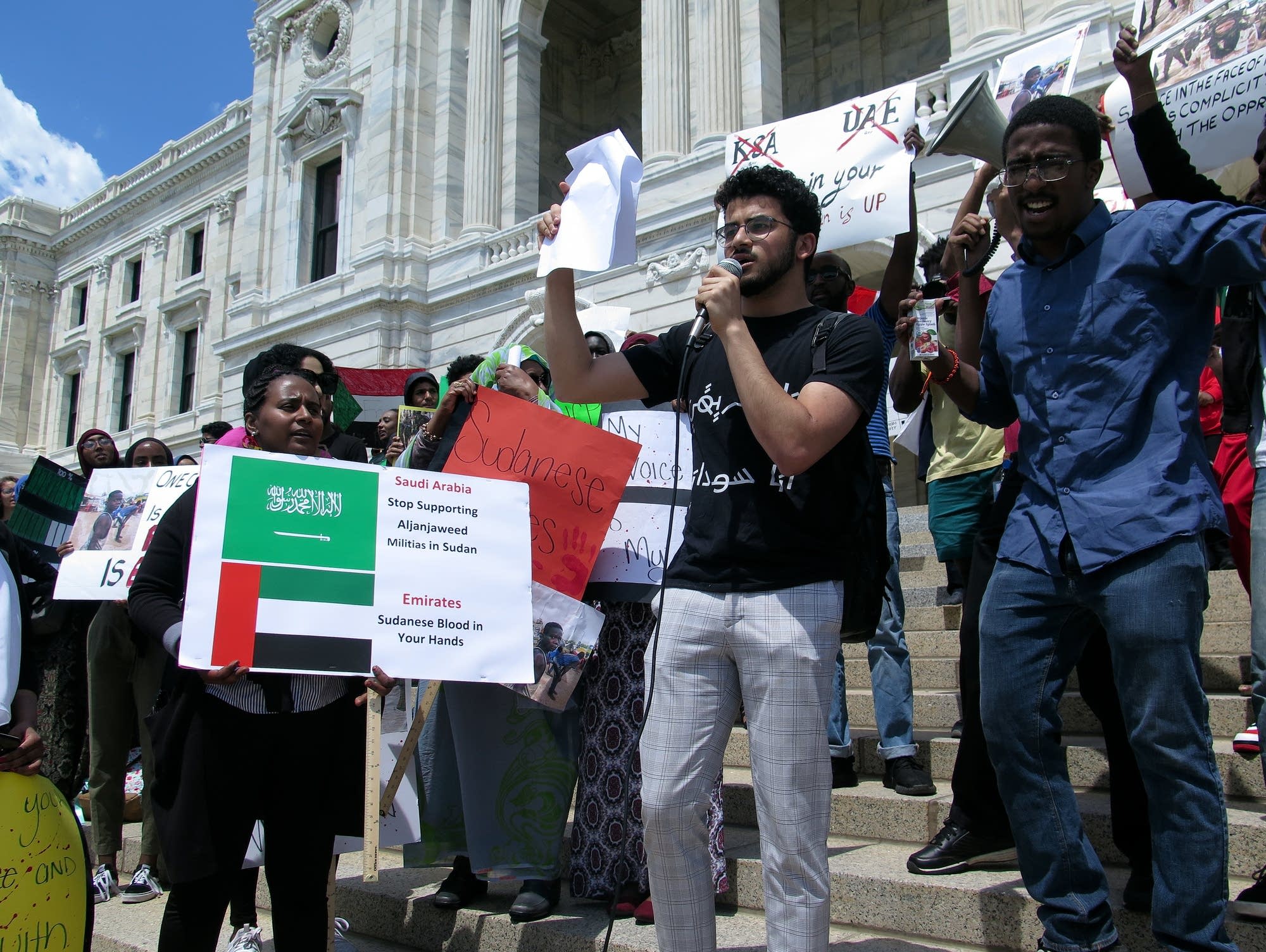 A crowd gathered in front of the state capitol to call for peace in Sudan.