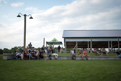 people enjoying live music at the currents outdoor happy hour