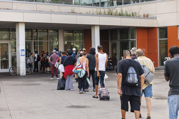 People line up outside the Saint Paul Opportunity Center