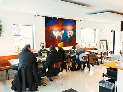 Heights Coffee Bar is a brightly lit shop hosting customers at tables in Columbia Heights, Minnesota.